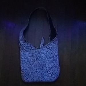 This is a rainbow doted shoulder bag.